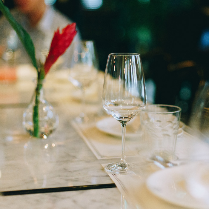 table setting with an empty wine glass